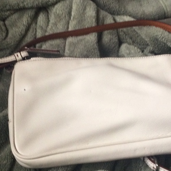 Vintage tan crossover leather purse. Has a Mark on back long adjustable strap. - Picture 2 of 4